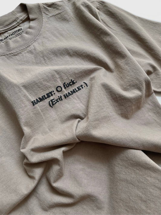 Unisex light brown 'What Would Hamlet Do?' Shroom heavy t-shirt by 10:AM Factory, featuring bold puff graphic print and 10:AM logo, crafted from 100% pigment-dyed cotton for a vintage look.