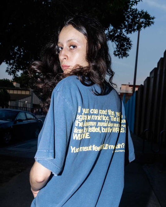 Unisex blue 'Strange Mind' heavyweight t-shirt by 10:AM Factory, featuring bold graphic print with 10:AM logo, crafted from high-quality, pigment-dyed cotton for a vintage look