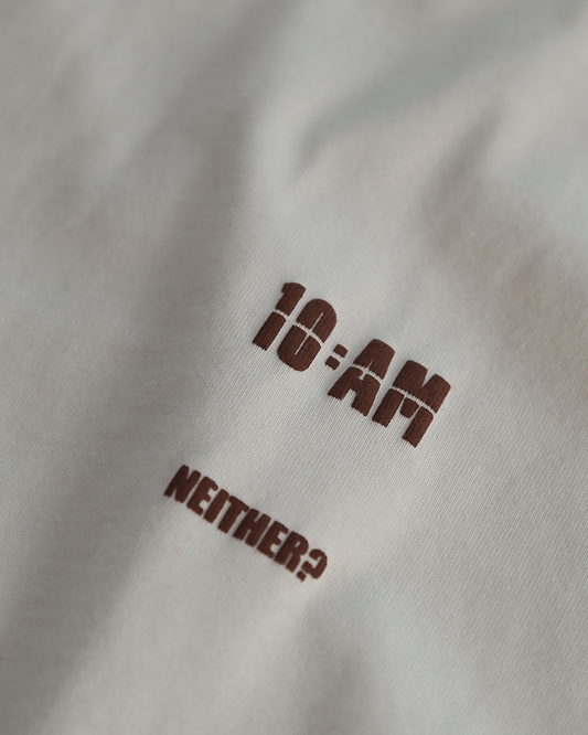 Unisex off-white 'Fear of What' oversized t-shirt by 10:AM Factory, featuring bold graphic print and 10:AM logo, crafted from high-quality, soft cotton for a modern, comfortable fit.