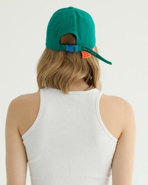 Green Cap with 10amfactory logo, stylish and eco-friendly headwear perfect for everyday use