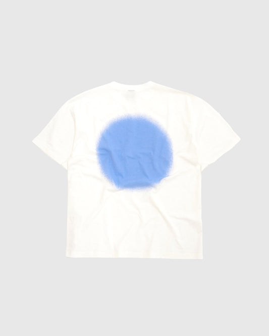 Unisex off-white 'Blue Sprayed' t-shirt by 10:AM Factory, featuring a bold blue spray graphic print and 10:AM logo, crafted from high-quality, soft cotton for a modern, streetwear-inspired look.