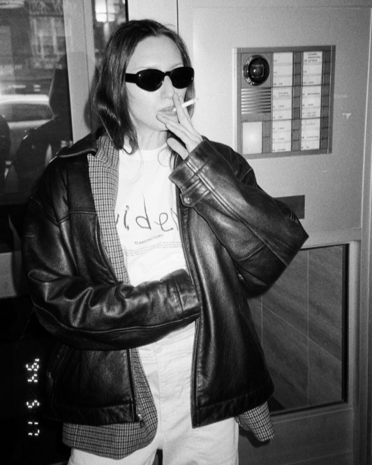 Unisex white 'Evidence' t-shirt by 10:AM Factory, featuring a minimalist graphic design and bold 10:AM logo, crafted from high-quality, soft cotton for a clean, modern look.