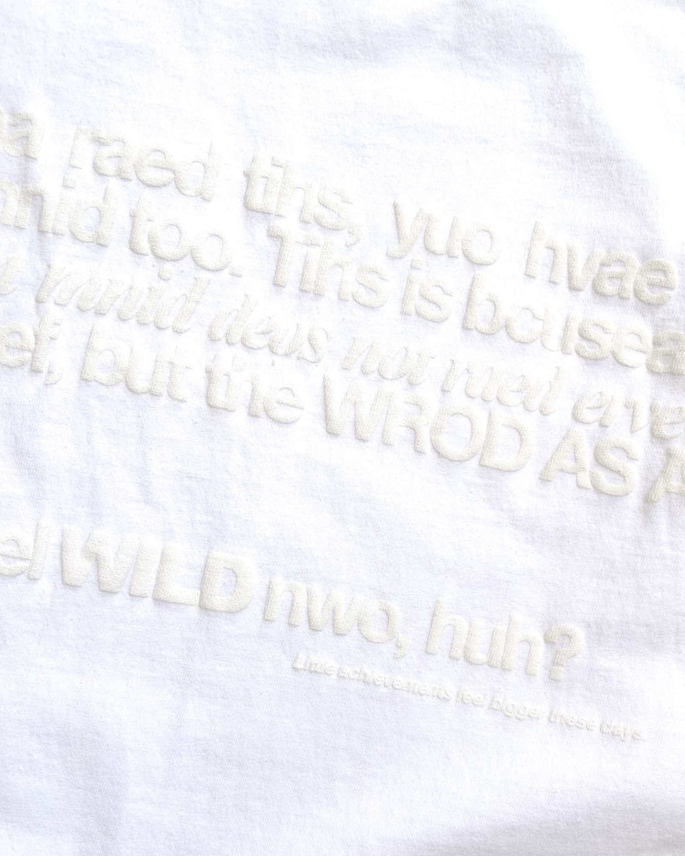 Unisex white 'Strange Mind' heavyweight t-shirt by 10:AM Factory, featuring a subtle white puff graphic print, crafted from high-quality, pigment-dyed cotton for a minimalist and timeless look.