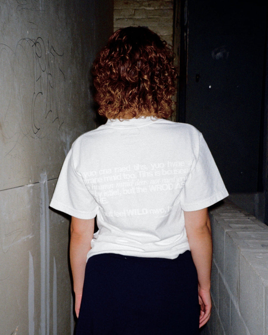Unisex white 'Strange Mind' heavyweight t-shirt by 10:AM Factory, featuring a subtle white puff graphic print, crafted from high-quality, pigment-dyed cotton for a minimalist and timeless look.