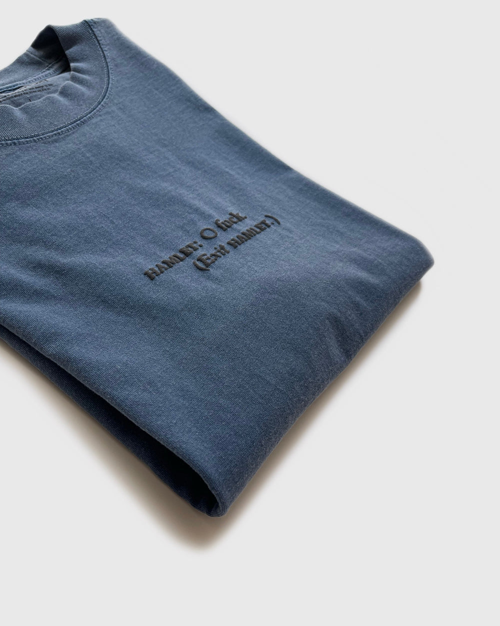 Unisex blue 'What Would Hamlet Do?' heavy t-shirt by 10:AM Factory, featuring bold puff graphic print and 10:AM logo, crafted from 100% pigment-dyed cotton for a vintage look.