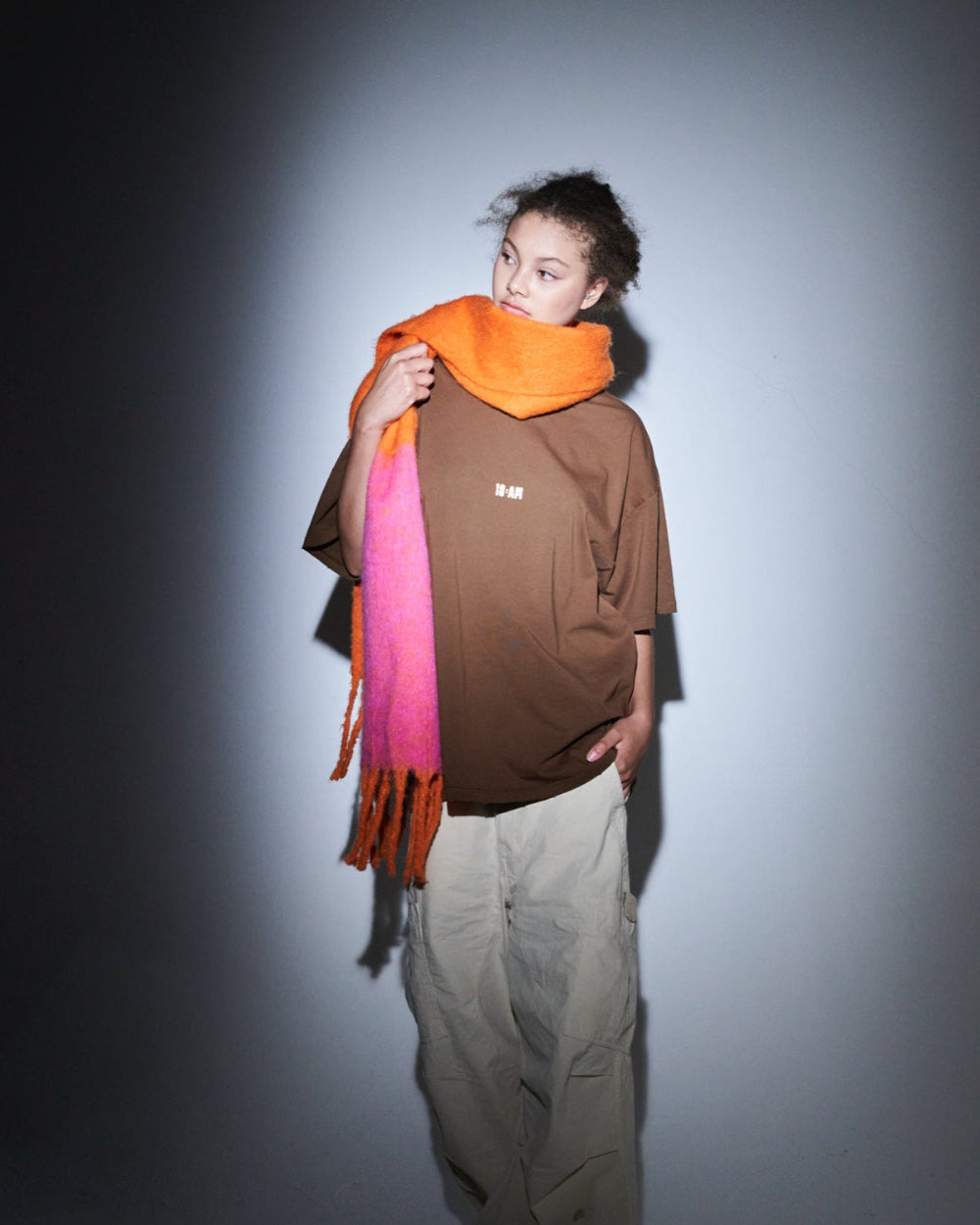 Unisex brown oversized t-shirt by 10:AM Factory, featuring the bold 'Sun Smells Different These Days' graphic print, crafted from high-quality, soft cotton for a relaxed, modern fit.