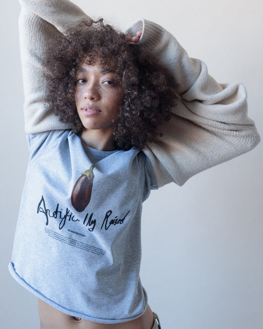 Unisex grey 'Artificially Raised' t-shirt by 10:AM Factory, featuring a bold big eggplant graphic print and 10:AM logo, crafted from high-quality, soft cotton for a clean, modern look.