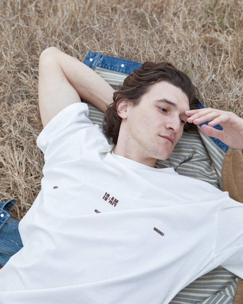 Unisex off-white 'Fear of What' oversized t-shirt by 10:AM Factory, featuring bold graphic print and 10:AM logo, crafted from high-quality, soft cotton for a modern, comfortable fit.