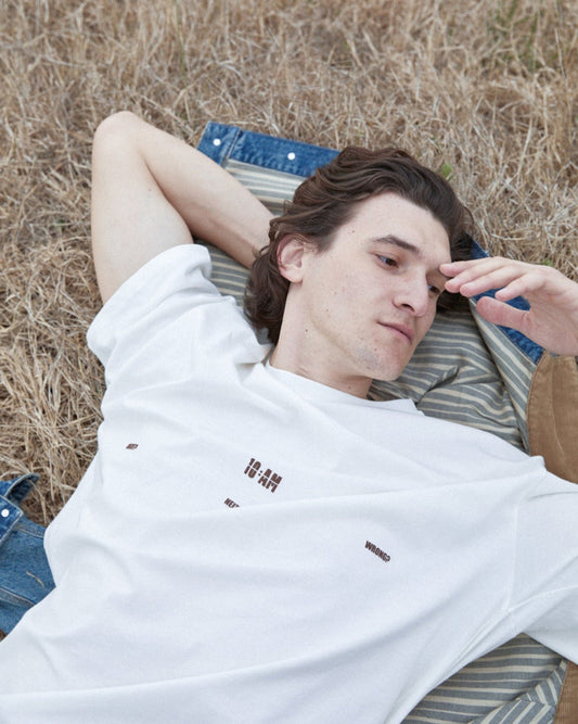 Unisex off-white 'Fear of What' oversized t-shirt by 10:AM Factory, featuring bold graphic print and 10:AM logo, crafted from high-quality, soft cotton for a modern, comfortable fit.