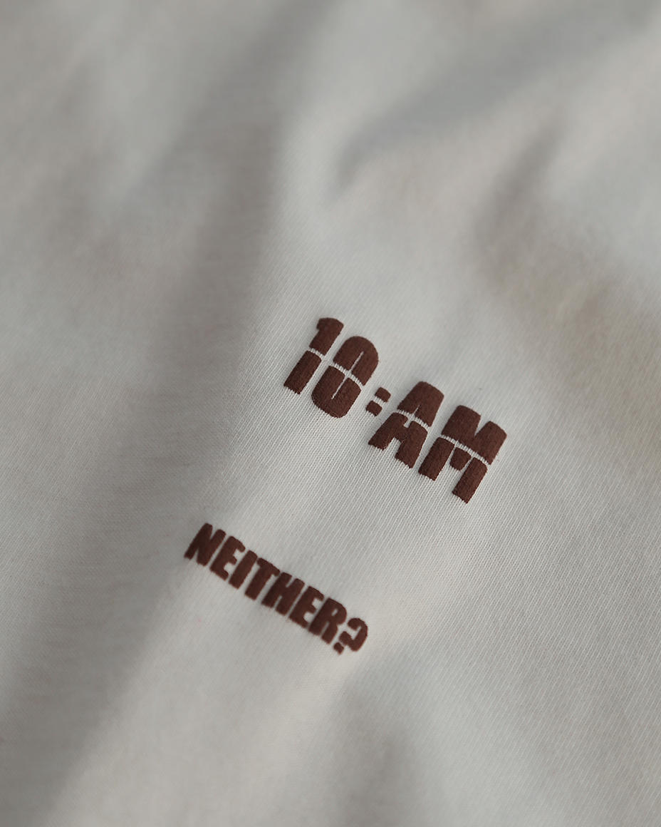 Unisex off-white 'Fear of What' oversized t-shirt by 10:AM Factory, featuring bold graphic print and 10:AM logo, crafted from high-quality, soft cotton for a modern, comfortable fit.
