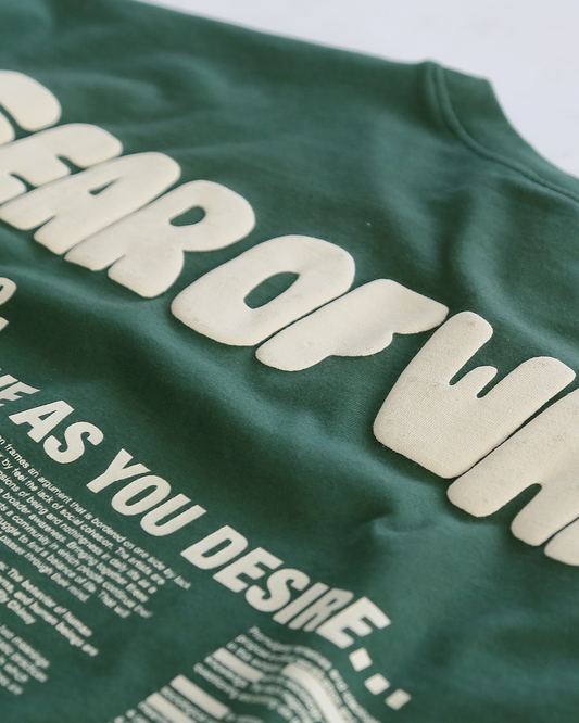 Unisex green 'Fear of What' oversized t-shirt by 10:AM Factory, featuring bold graphic print and 10:AM logo, crafted from high-quality, soft cotton for a comfortable and stylish fit.